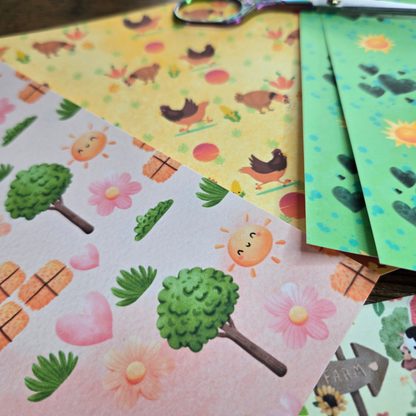 Colorful paper sheets with nature-themed designs on a wooden surface