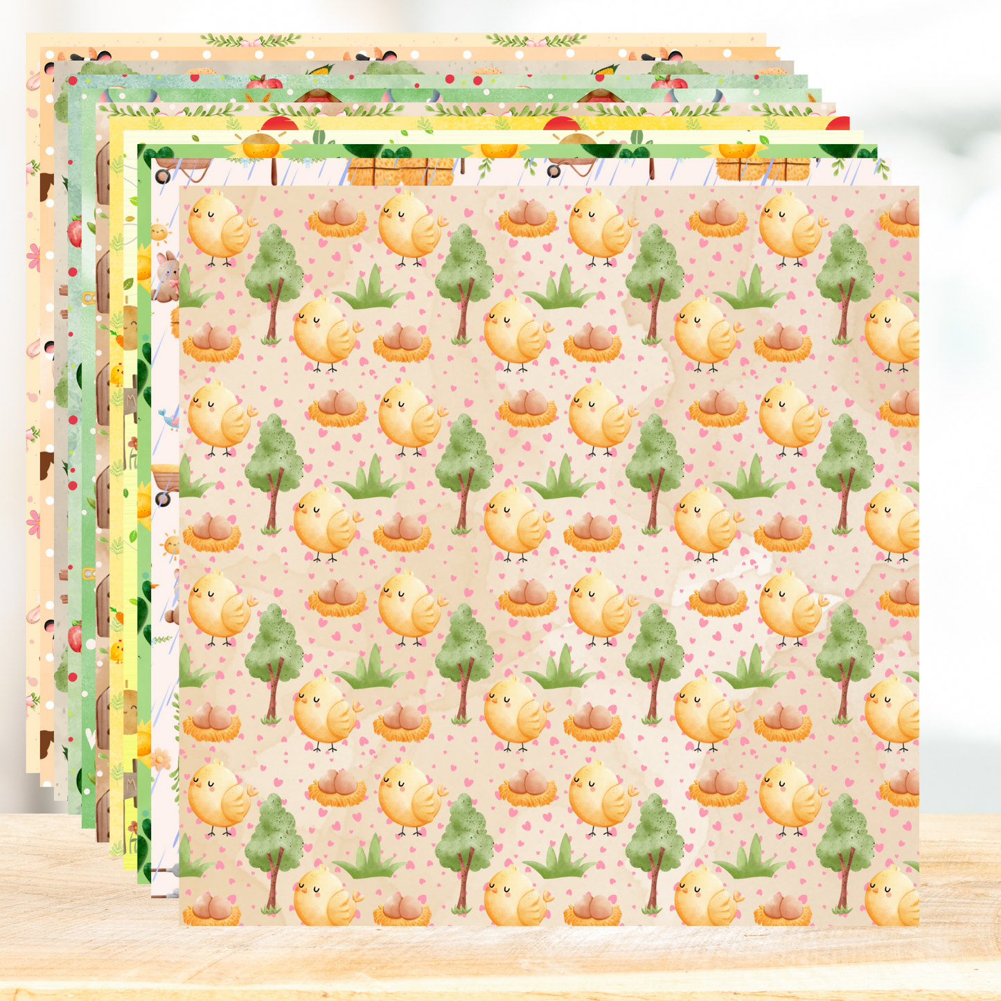 Set of colorful paper sheets with cute chicken and tree pattern on a wooden surface